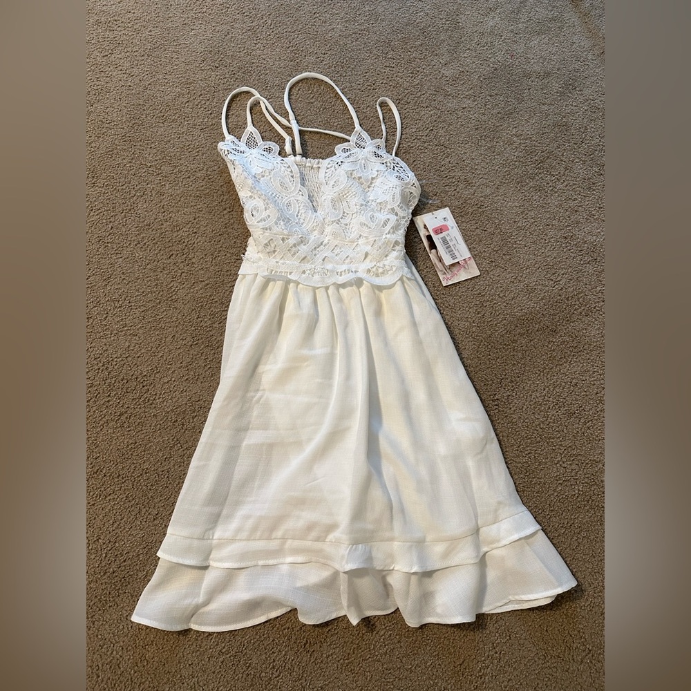 fits like a small but is an xs, white, lacey, brand honey and rosie